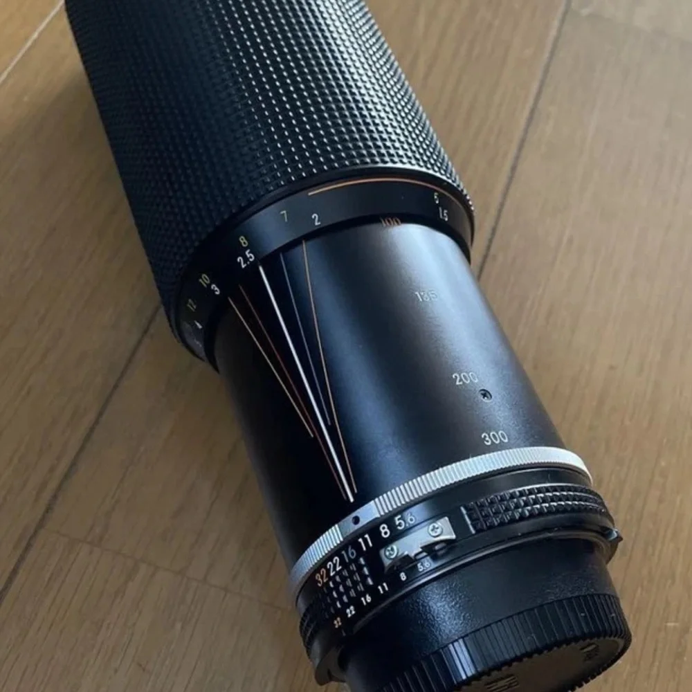 Nikon Black 300mm Telephoto Lens camera and multiple lenses and other parts